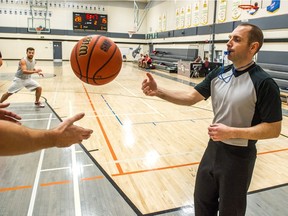 Chris Brischuk, right, is among the Regina Association of Basketball Officials members who is helping a good cause during November.