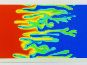 A video plays on a computer screen in Qingwang Yuan's research lab at the U of R. The researcher has developed software that predicts the way oil will react with water or other solvents injected into wells in the heavy oil recovery process.