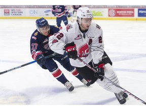 Noah Gregor of the Moose Jaw Warriors is chased by the Regina Pats' Matt Bradley during WHL action at the Brandt Centre on Friday.