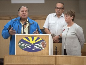 Aura Lee MacPherson (right) listens as Wendell Starblanket speaks after a pipe ceremony held at the Treaty Four Governance Centre in Fort Qu'Appelle, which was held to raise public awareness regarding the Quill Lakes Watershed Authority's proposed diversion project.