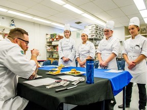 (From left) Chef David Westerlund samples dishes made by Grade 11 students Emma Compton, Kyra Yeo, Breanna Morrison and Emily Schwab, who all participated in the second annual Regina Catholic School Division cooking competition held at Miller High School on Saturday, Nov. 18, 2017.