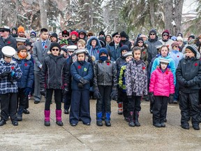 A crowd looks on during the Remembrance Day service at the Cenotaph in Victoria Park.