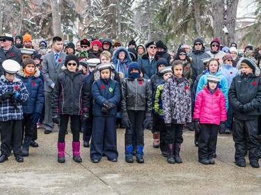 A crowd looks on during the Remembrance Day service at the cenotaph in Victoria Park.