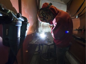 In a photo from November 8, Collins Akalam welds at Saskatchewan Polytechnic. Enrolment in trades apprenticeships are down due to a stunted Saskatchewan economy, according to Saskatchewan Apprenticeship and Trades Certification Commission CEPO Jeff Ritter.