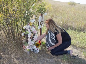 Dakota Schmidt visits a roadside memorial at the site of a crash where her mother, Daphne, was killed by an impaired driver approximately 40km's north of Regina on Highway 6.