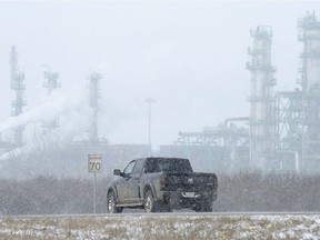 Blowing snow reduces visibility near the Co-op Refinery Complex.