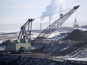 A giant drag line works in the Highvale Coal Mine to feed the nearby Sundance Power Plant near Wabamun, Alta. on Friday, Mar. 21, 2014.