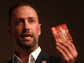 Ry Moran, director of the National Centre for Truth and Reconciliation holds up a book containing the TRC's 10 principles of reconciliation and 94 Calls to Action. Moran sat down with the Leader-Post to discuss the state of reconciliation since the TRC's final report was released in 2015.