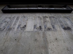 Dirt is all that remains from a bus depot sign on the former STC building, that was purchased by Meridian Developments, in Saskatoon, SK on Friday, December 15, 2017.