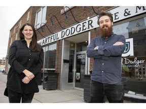 Kelly Cairns, left, and Jake Van Oostdam are two of the five owners of The Artful Dodger.