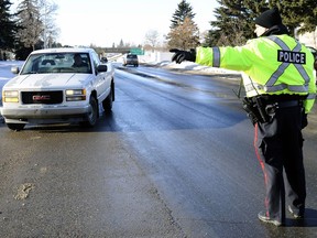 In this file photo, Regina police are shown conducting a check stop for impaired drivers during the holiday season.