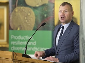 Environment Minister Dustin Duncan releases the province's new made-in-Saskatchewan climate change plan at the Legislative Building in Regina.