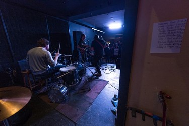 The band Etienne Fletcher plays a set at the Artful Dodger on the final night the business was open. The sign on the wall to the right displays the lineup of ten acts that made up the final show to be played at the venue.