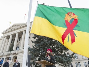 Kristin Dunn, peer support worker for AIDS Saskatoon, speaks at the raising of a provincial HIV flag at the Legislative Building.