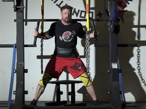 Powerlifter Lee Powell uses a mono lift during a training session at Adrenaline Strength and Conditioning.