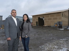 REGINA, SASK : December 11, 2017 - Moni and Manjit Minhas stand at the construction site where Minhas Sask Ventures Inc. is constructing a multi-million dollar distillery and winery at 444 McLeod St. The distillery and winery will feature a tasting room, offsales, a retail store and a gift shop. MICHAEL BELL / Regina Leader-Post.