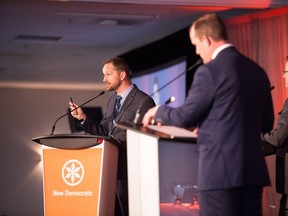 NDP leadership candidates Trent Wotherspoon (right) and Ryan Meili face off in a debate at the Queensbury Convention Centre in Regina.