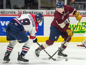 The Regina Pats' Cale Fleury, right, battles for the puck with the Lethbridge Hurricanes' Giorgio Estephan during Saturday's game at the Brandt Centre. Estephan had a goal as Lethbridge won 6-2.