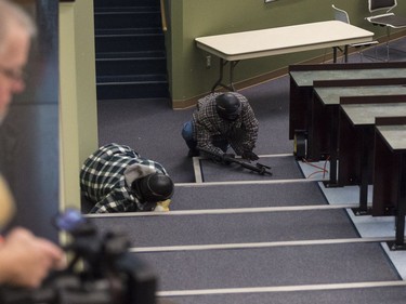 The actors playing the shooters take cover.