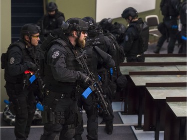 REGINA, SASK : December 12, 2017 - An simulated active-shooter situation plays out as Regina Police Service Emergency Services teams conducte realistic, scenario-based training at Saskatchewan Polytechnic.  9. SWAT members look for other threats. MICHAEL BELL / Regina Leader-Post.