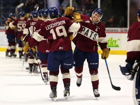 The Regina Pats' Jake Leschyshyn, 19, celebrates with Matt Bradley, right, against the Medicine Hat Tigers on Saturday.