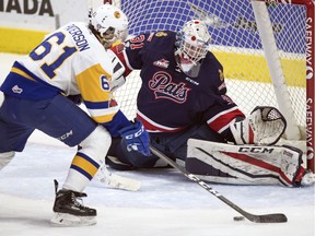 Josh Paterson of the Saskatoon Blades can't get the puck past Regina Pats goalie Tyler Brown during second-period WHL action at the Brandt Centre on Friday.