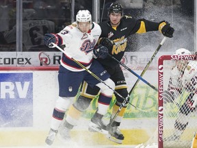 Regina Pats forward Jared Legien collides with Connor Gutenberg of the Brandon Wheat Kings in WHL action at the Brandt Centre on Thursday night.