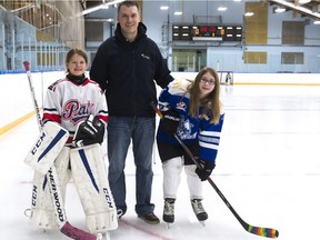 Hockey is a family affair for Russ Robertson and his daughters Morgan, left, and Rhianna.
