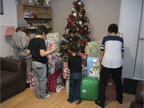 The kids could hardly wait to open their Christmas presents at WISH Safe House in Regina.