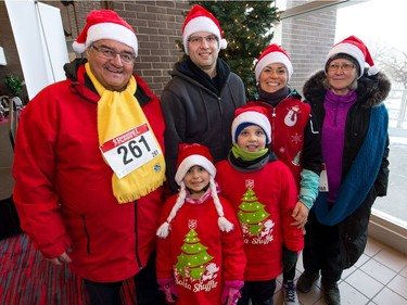 (From left) Cal Howell, Emily Dalziel, Aaron Dalziel, Everett Dalziel, Kelly Dalziel and Christel Howell pose for a photo at the Conexus Arts Centre prior to the Santa Shuffle walk/run event. Everett was celebrating his 9th birthday by participating in the run in Regina on Saturday, Dec. 2, 2017.