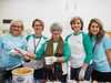 SaskEnergy and Brown Communications employees serve lunch at George Ferguson School for Regina Food For Learning's Share the Warmth day.