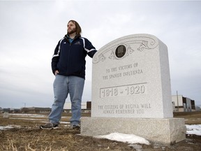 Kenton de Jong with the Spanish flu memorial in the Regina Cemetery. The memorial will be unveiled later this week.