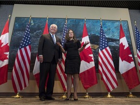 Foreign Affairs Minister Chrystia Freeland gestures to photographers following a photo op with U.S. Secretary of State Rex Tillerson in Ottawa, Tuesday December 19, 2017.