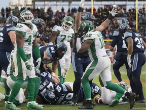 The Saskatchewan Roughriders' show their dejection as the Argonauts' Cody Fajardo gets the winning touchdown. The Toronto Argonauts beat the Saskatchewan Roughriders at BMO Field on Nov. 19, 2017.