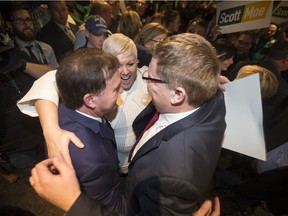 Gord Wyant, Tina Beaudry-Mellor and premier-elect Scott Moe Hug after Moe won the Saskatchewan Party leadership during the party's leadership convention in Saskatoon on Sat., Jan. 27, 2018.