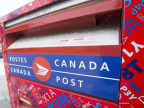 A Canada Post mailbox is seen at a sorting centre in Montreal, Friday, July 8, 2016. The Canadian Union of Postal workers has called for a 30-day truce to negotiate a new contract and avoid a strike or lockout.