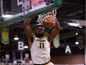Dunks are part of the repertoire of University of Regina Cougars basketball player Brian Ofori.