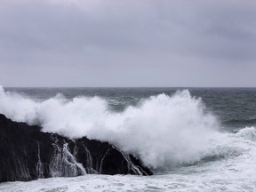 Waves crash against rugged rocks along the Wild Pacific Trail in Ucluelet, B.C. on Friday, Jan. 19, 2018. A tsunami warning has been posted for the coast of British Columbia and Alaska following a powerful earthquake in the Gulf of Alaska.