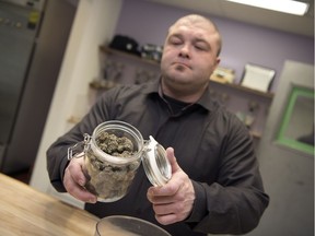 Pat Warnecke, owner of Best Buds Society, shows off his product in his shop in Regina.