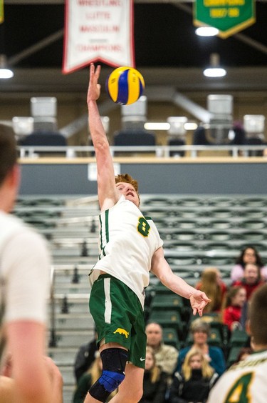 The University of Regina Cougars Ryan Metcalf spikes the ball during a game against the Thompson Rivers University Wolfpack on Jan. 13, 2017.