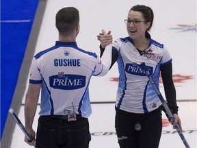 Val Sweeting of Edmonton and Brad Gushue shake hands after defeating Geoff Walker and Laura Crocker 7-4 in round 1 of the playoffs. michael burns photo