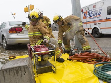 Regina Fire and Protection Services crews set up the Jaws of Life.