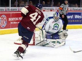 Swift Current Broncos goaltender Stuart Skinner, right, foils the Regina Pats' Cameron Hebig on Sunday at the Brandt Centre.