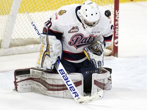 Regina Pats goalie Ryan Kubic keeps a close eye on this shot during first-period WHL action against the Medicine Hat Tigers on Friday night at the Brandt Centre.