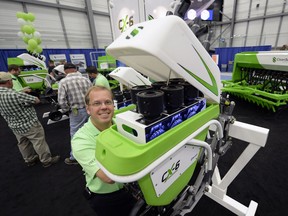 Graeme Lempriere, CEO of Clean Seed, with the CX-6 cross-over drill at the Canada Farm Progress Show in Regina in 2013.