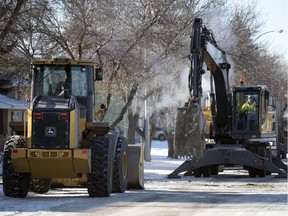 City crews work on finishing repairs to a up a water main break 12th Avenue North just west of Winnipeg Street in Regina on Jan. 12, 2018.