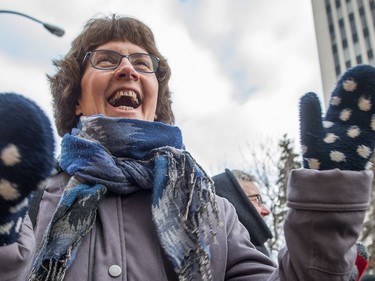 A participant in the Women's March Regina dances as music gets the crowd stirred up prior to the march setting off on Jan. 20, 2018.