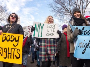 Participants in the Women's March Regina walk along College Avenue on Jan. 20, 2018.