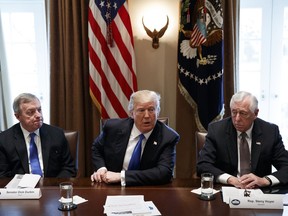 In this Jan. 9, 2017, photo, Sen. Dick Durbin, D-Ill., left, and Rep. Steny Hoyer, D-Md. listen as President Donald Trump speaks during a meeting with lawmakers on immigration policy in the Cabinet Room of the White House in Washington. Bargainers seeking a bipartisan immigration accord planned talks as soon as Wednesday as President Donald Trump and leading lawmakers sought to parlay an extraordinary White House meeting into momentum for resolving a politically blistering issue.