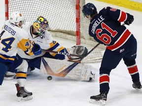 Saskatoon Blades goaltender Nolan Maier blocks a shot from Regina Pats forward Jesse Gabrielle during WHL action at SaskTel Centre on Sunday.